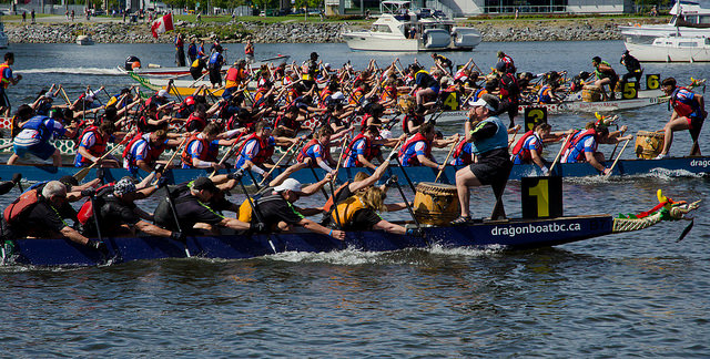 Photo of dragon boats racing at the Vancouver Dragon Boat Festival