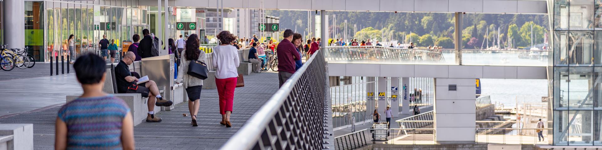 People walking along Canada Place near the Vancouver Cruise Terminal