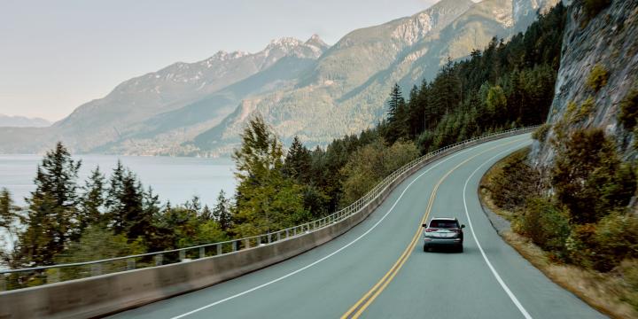 A photo of a car driving up the Sea to Sky Highway in British Columbia