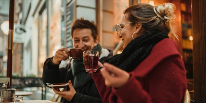 Two people enjoying a cozy cup of tea and coffee