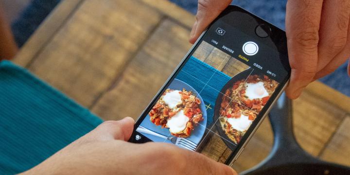 Photo of person taking picture of food