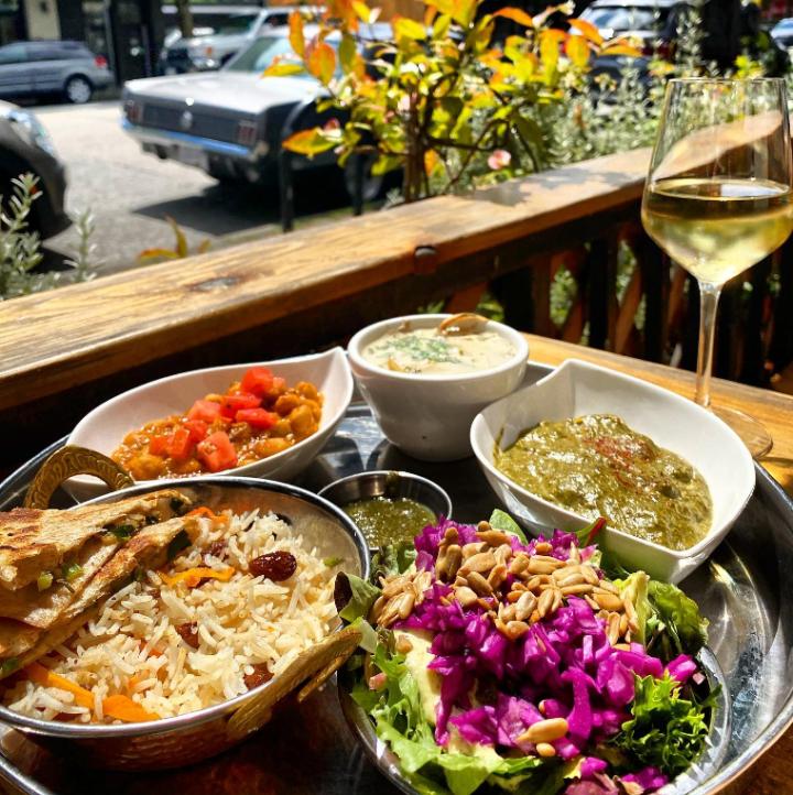 A platter of curries and other food delicacies at East is East