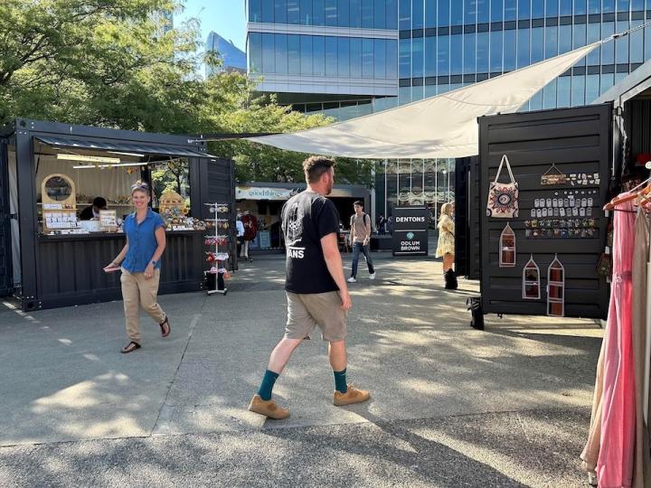People walking around the Junction Public Market in Downtown Vancouver