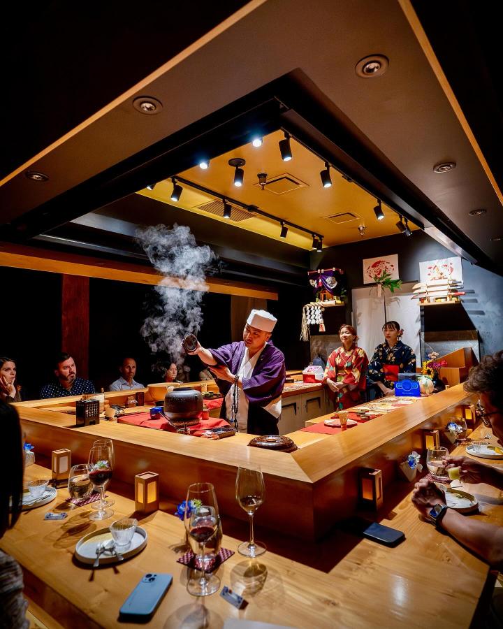 Chef serving food at Okeya Kyujiro