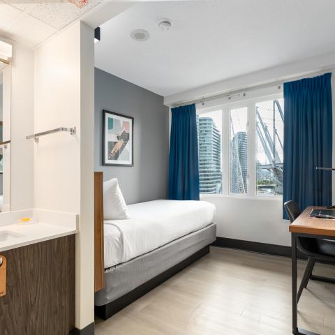 Single Bed Room with Desk and Vanity for Residents