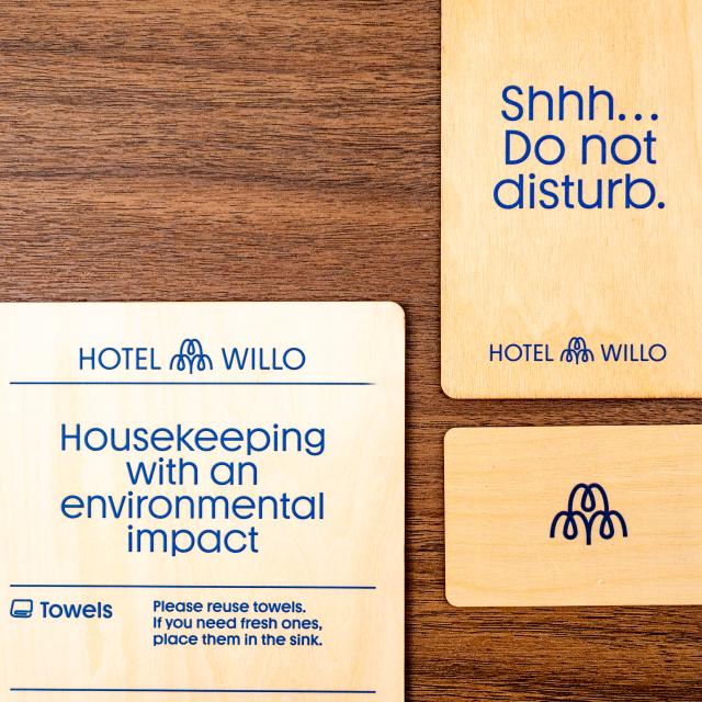 Hotel Willo uses wooden key cards, do not disturb signs and housekeeping eco signs.