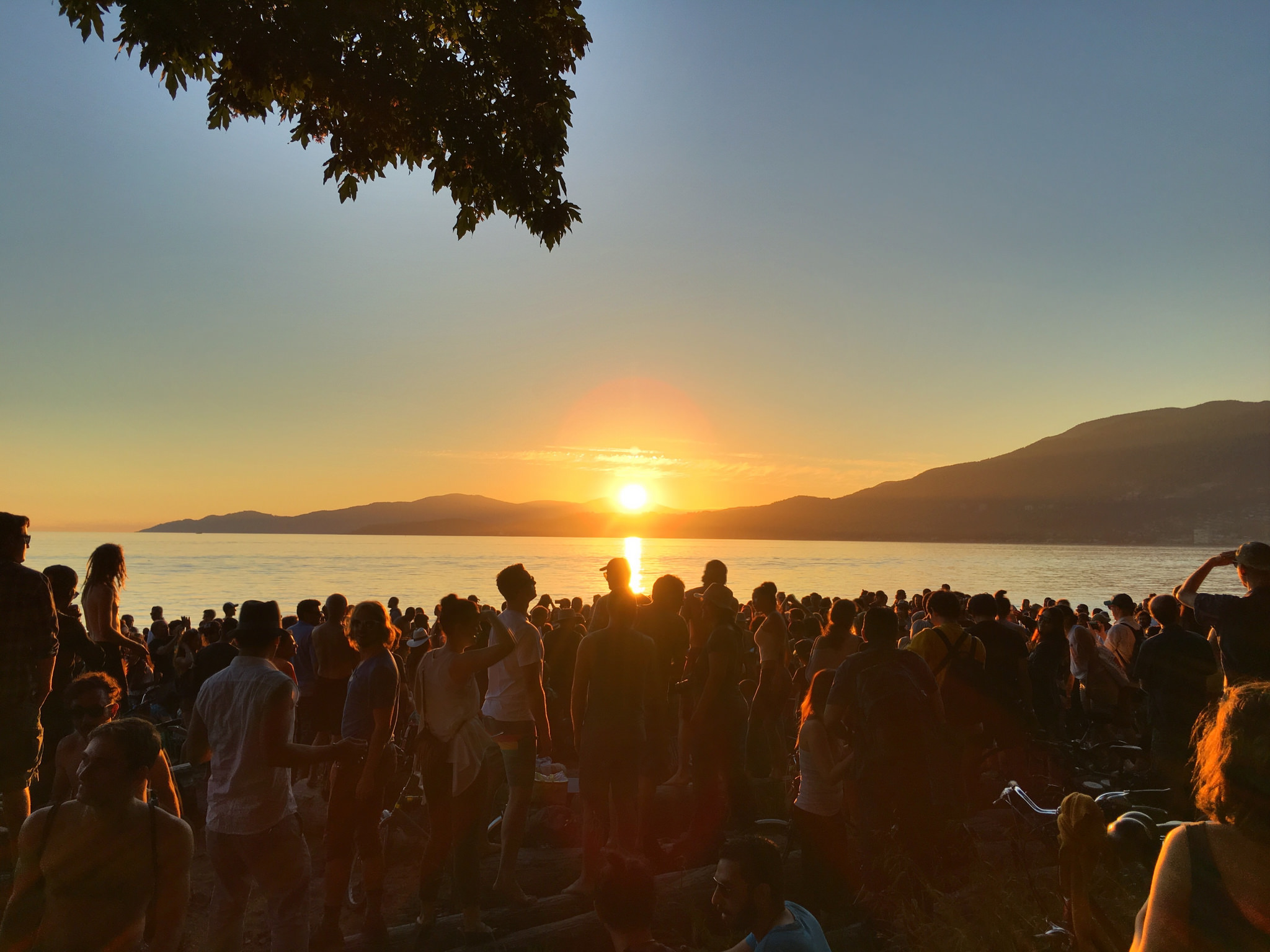 Photo of drum circle during sunset at Third Beach